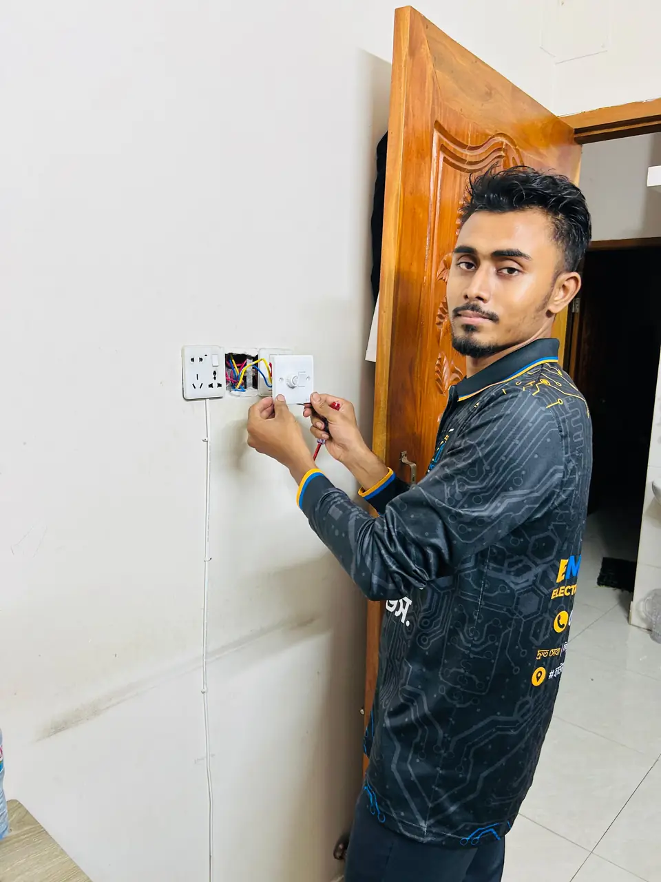 Our technician at a customer's flat in uniform